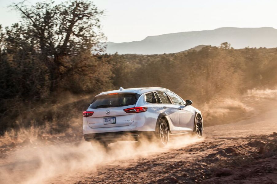 A rearview of the 2020 Buick Regal TourX driving through a desert