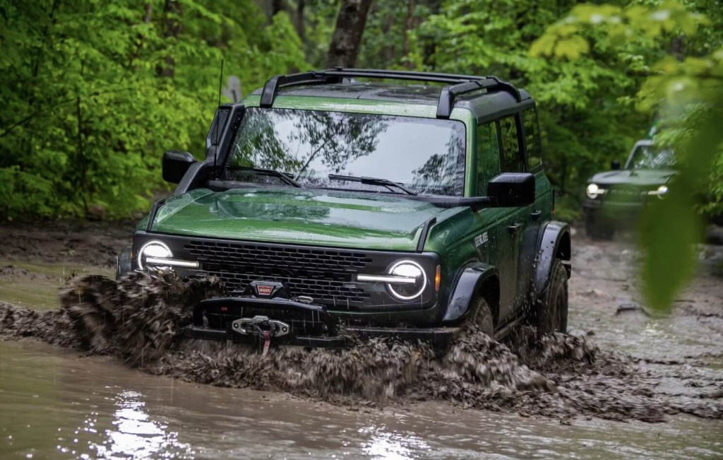 The 2023 Ford Bronco Everglades off-roading in deep mud and water