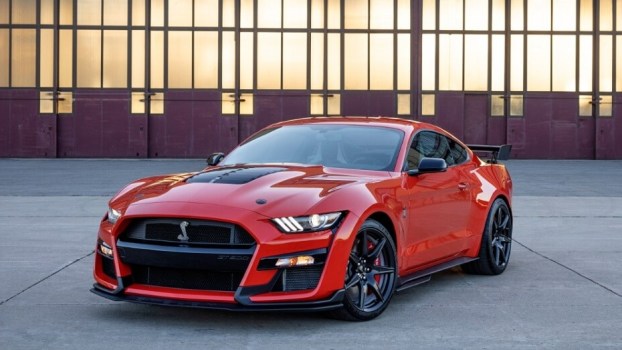 The 2022 Ford Mustang Shelby GT500, the fastest production Mustang ever, poses by a hangar.