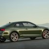A green 2023 Audi A5 Coupe shows off its two-door body.