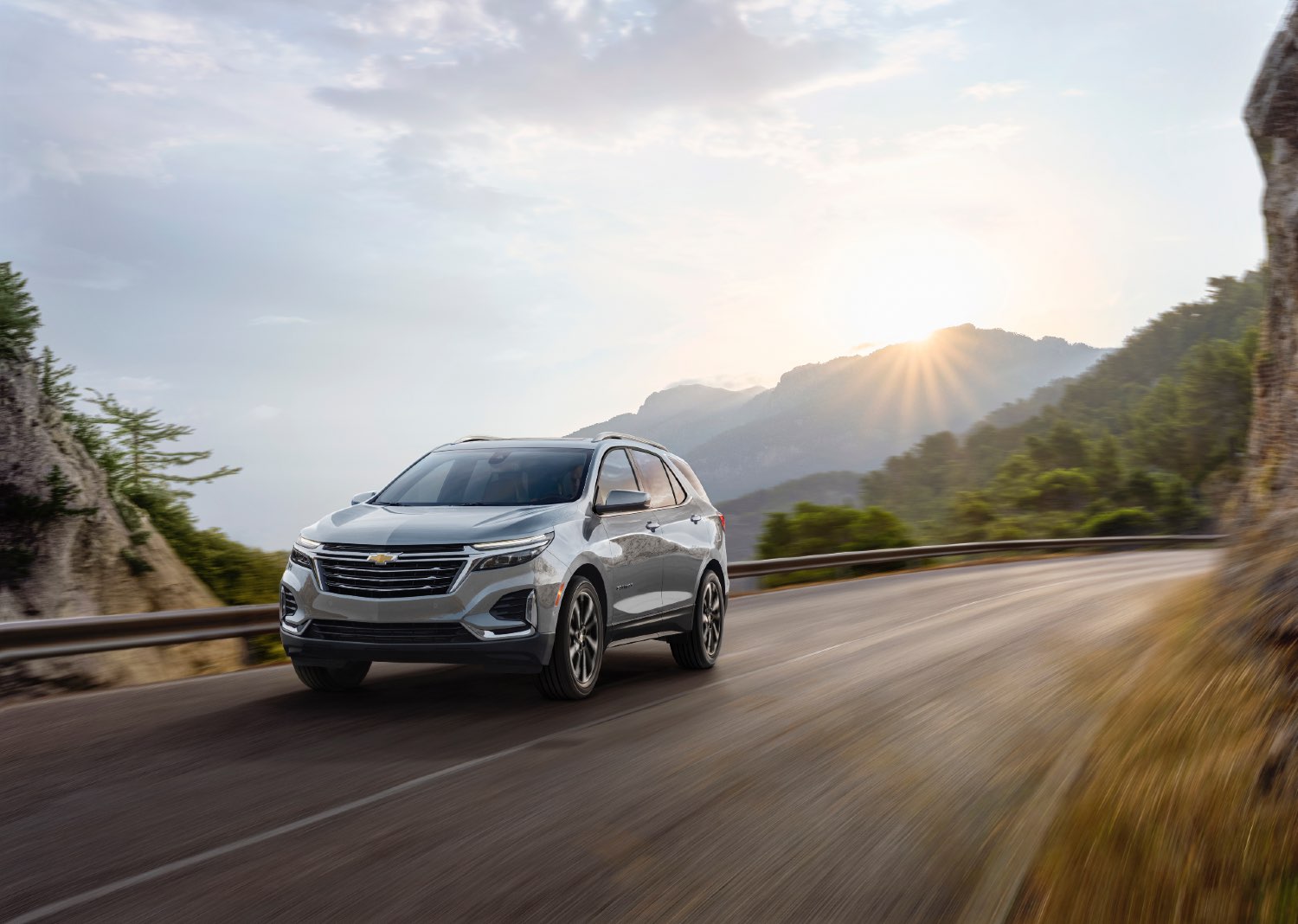 A 2023 Chevy Equinox driving down a highway.
