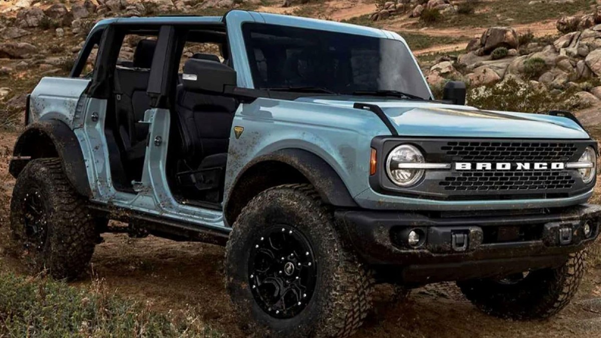 Blue 2023 Ford Bronco 4-Door with Doors Off playing in the mud - this off-road SUV could be better than the 2023 Jeep Wrangler