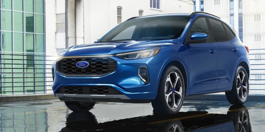 A blue 2023 Ford Escape Plug-In Hybrid small PHEV SUV is parked. 