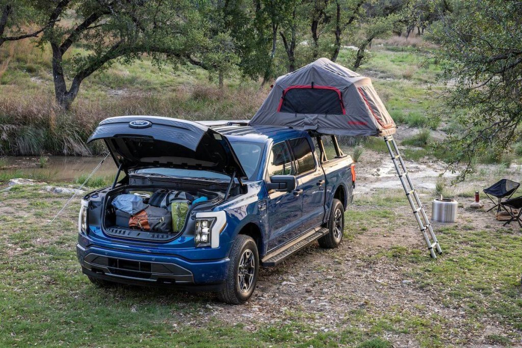 2023 Ford F-150 Lightning in camping scene