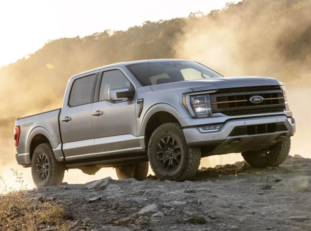 The 2023 Ford F-150 Tremor off-roading over rocks