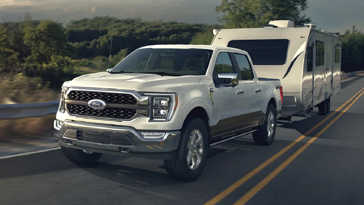 2023 Ford F-150 full-size pickup truck towing a camper