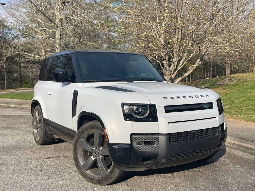 The 2023 Land Rover Defender 90 by flowering trees