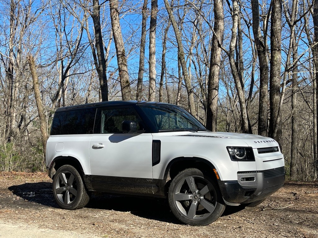 The 2023 Land Rover Defender 90 on a wooded trail