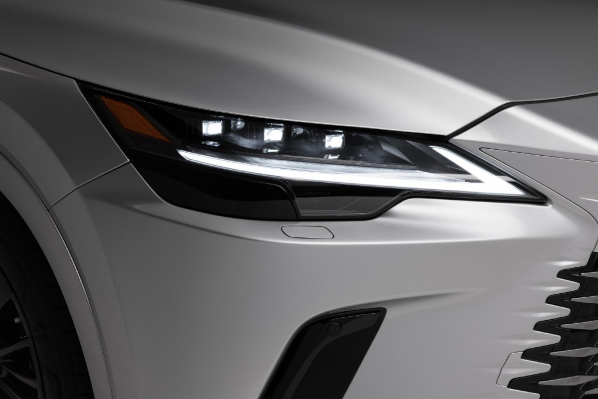 Silver 2023 Lexus RX 230 up close headlights. The Highlander is a new Toyota SUV that's a good alternative.