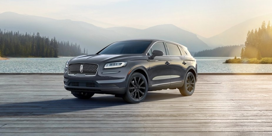 A gray 2023 Lincoln Nautilus midsize luxury SUV is parked on a boardwalk. 