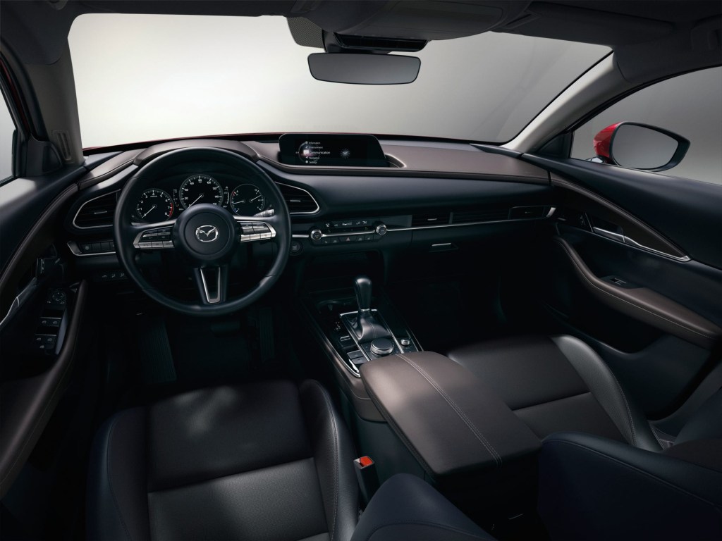 View of the front cabin space inside a 2023 Mazda CX-30. 