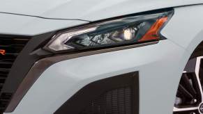 A close up of a 2023 Nissan Altima headlight, which is one of the safest cars of 2022.