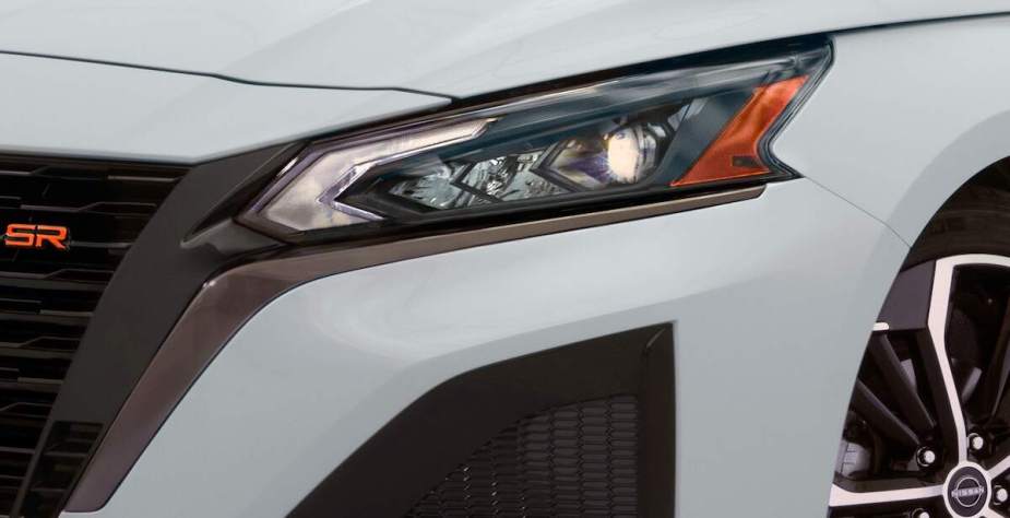 A close up of a 2023 Nissan Altima headlight, which is one of the safest cars of 2022.