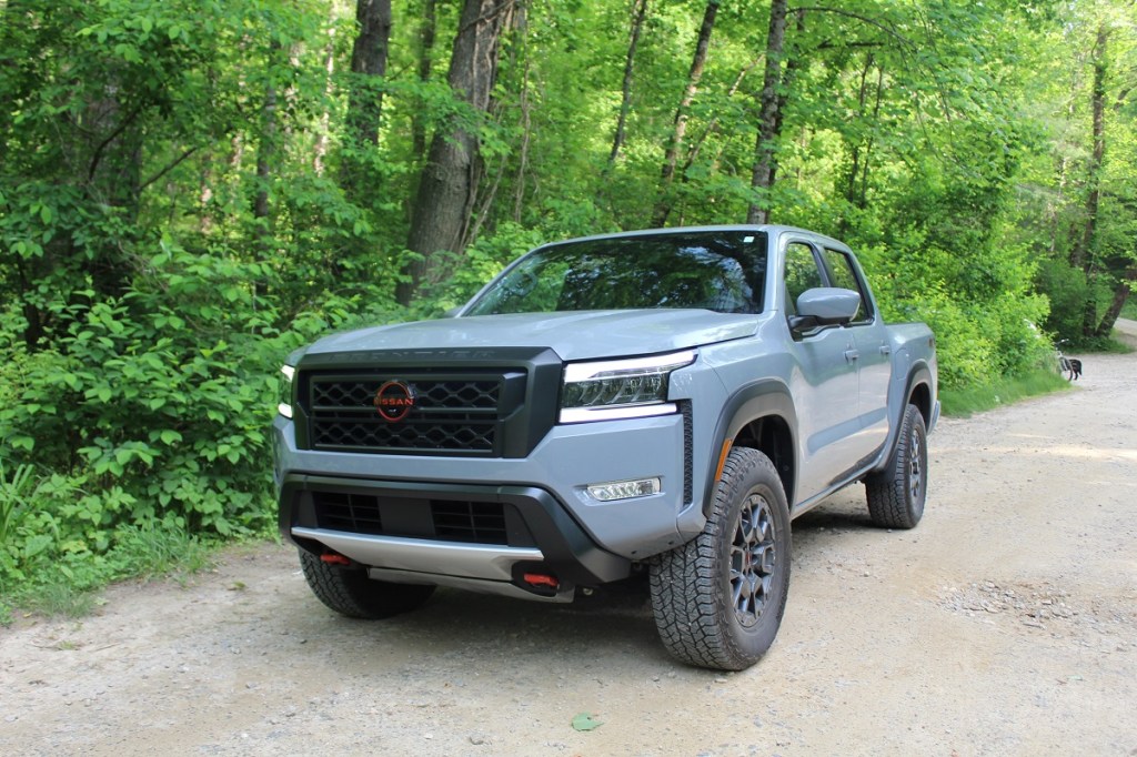 The 2023 Nissan Frontier Pro-4X off-roading in the woods