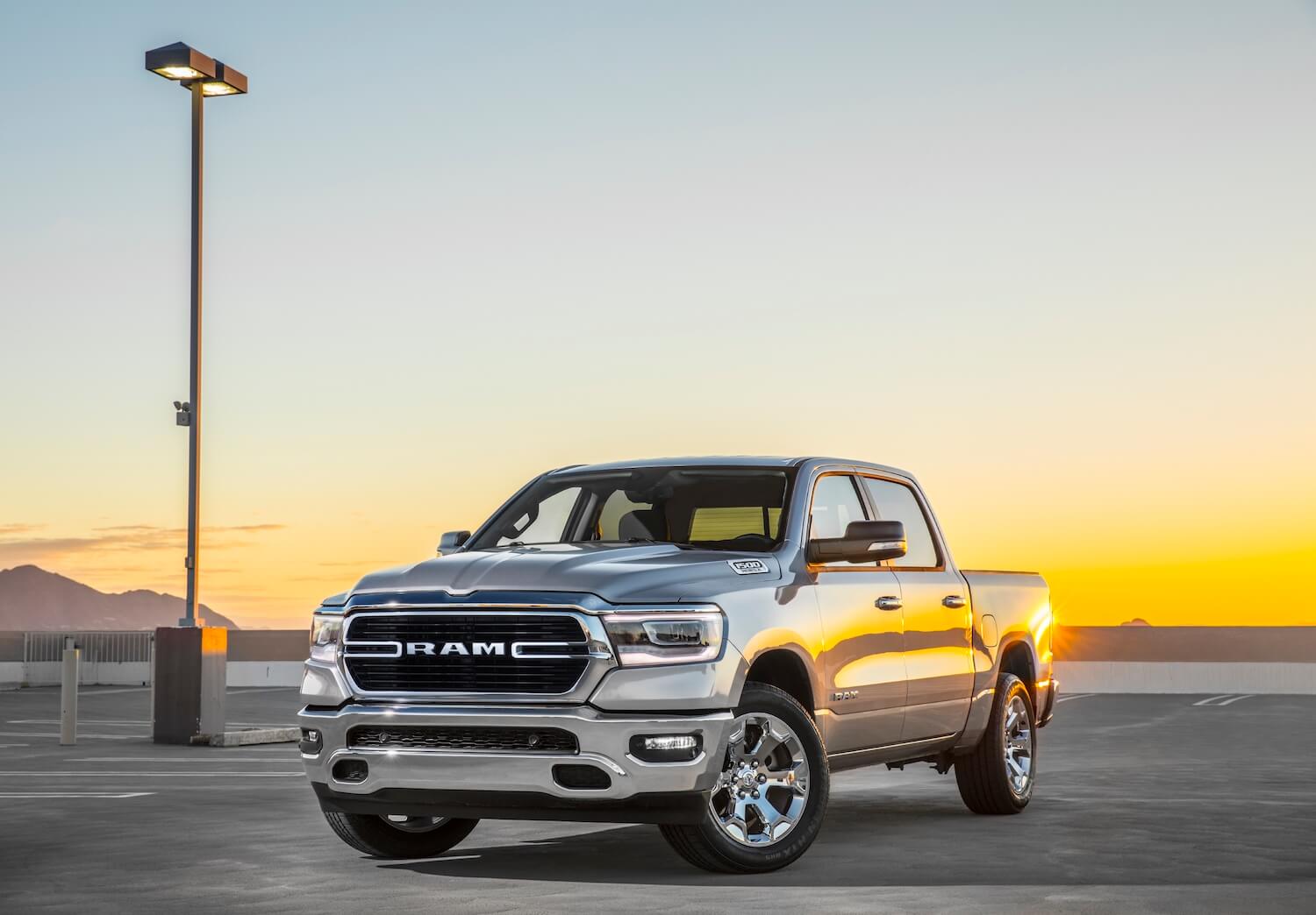 The 2023 Ram 1500 parked on pavement at dusk