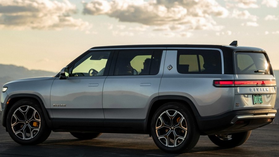 A gray 2023 Rivian R1S full-size SUV is parked.