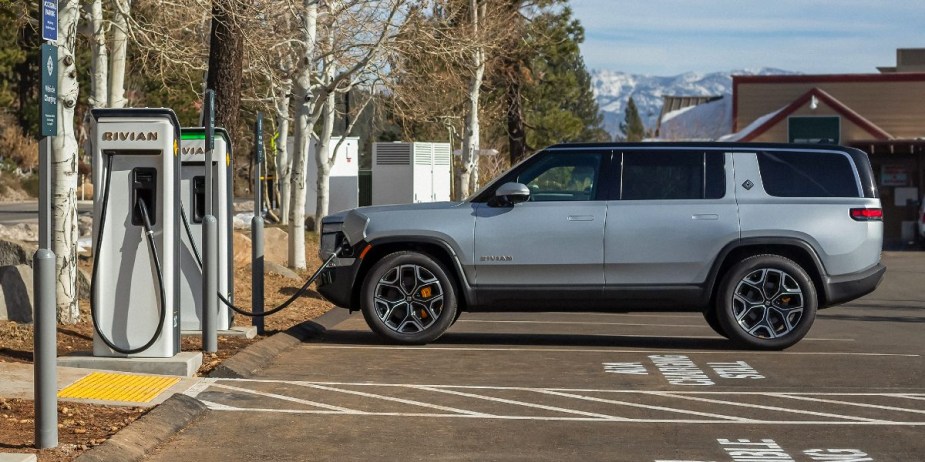 A gray 2023 Rivian R1S is charging. 