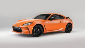 An orange anniversary edition 2023 Toyota GR86 celebrates its sports car heritage.