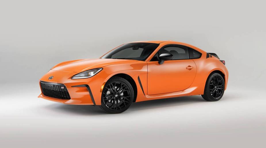 An orange anniversary edition 2023 Toyota GR86 celebrates its sports car heritage.