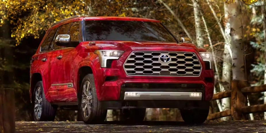 A red 2023 Toyota Sequoia full-size SUV is parked. 