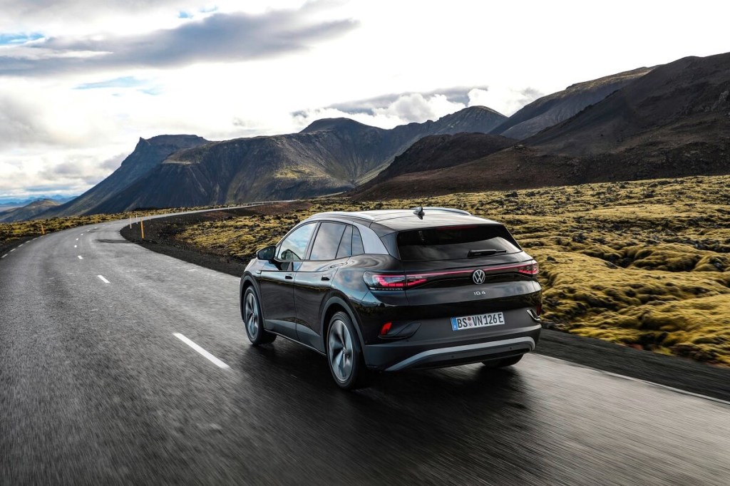 A black Volkswagen ID.4 corners around a mountain road.