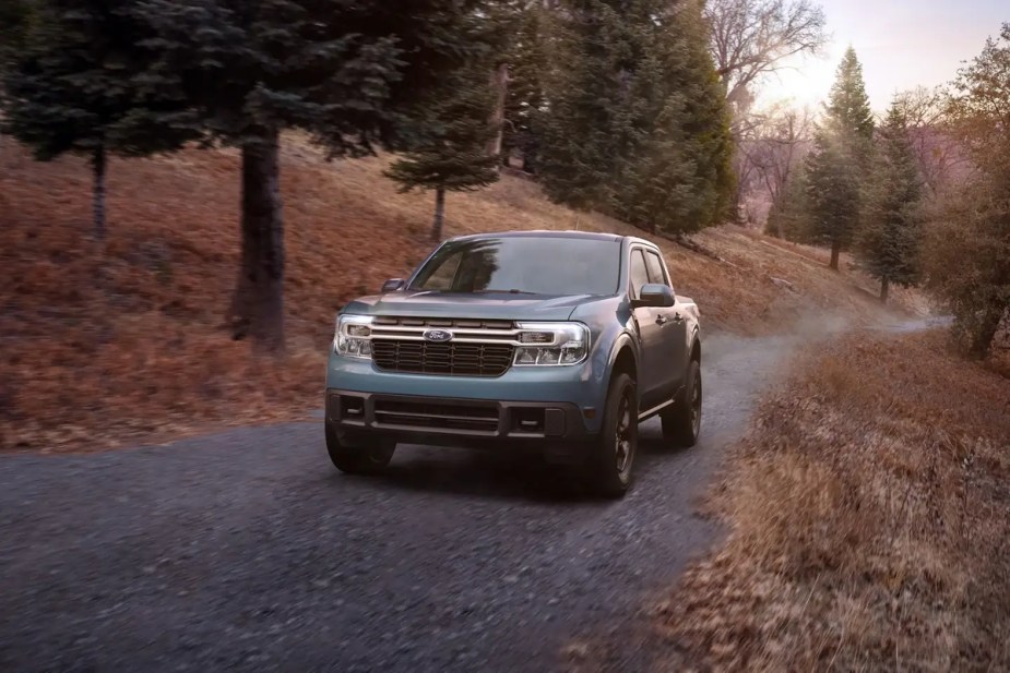 Ford's small truck, the 2023 Maverick is driving on a dirt road.