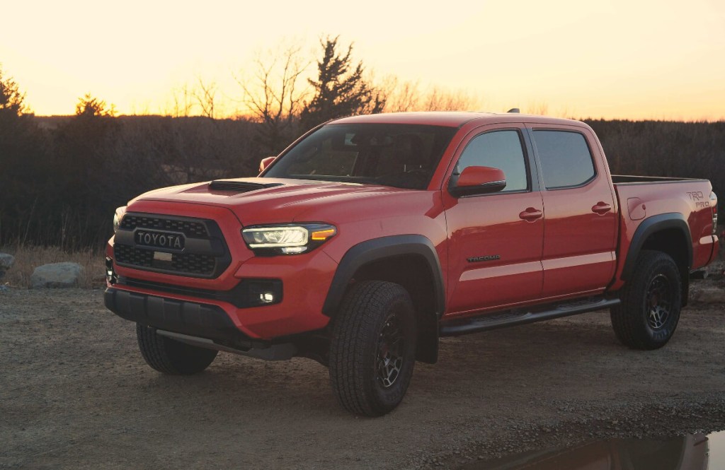 A 2023 Toyota Tacoma TRD Pro midsize truck at dusk.