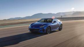The 2023 Subaru BRZ is almost a complete package, and it looks great too as evidenced by this blue model driving down an open road