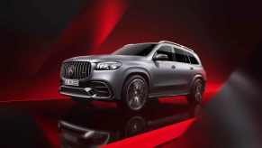 The 2024 Mercedes-Benz GLS SUV on a red background