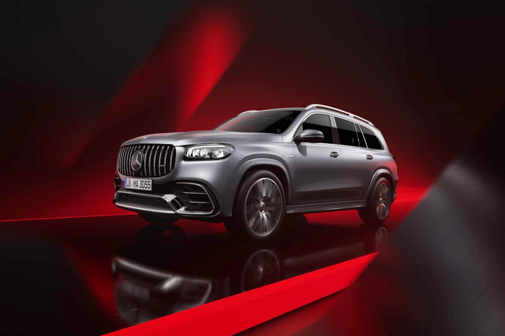 The 2024 Mercedes-Benz GLS SUV on a red background