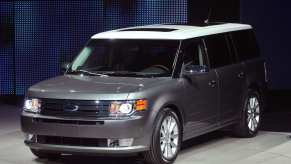 A silver Ford Flex on display at an auto show.