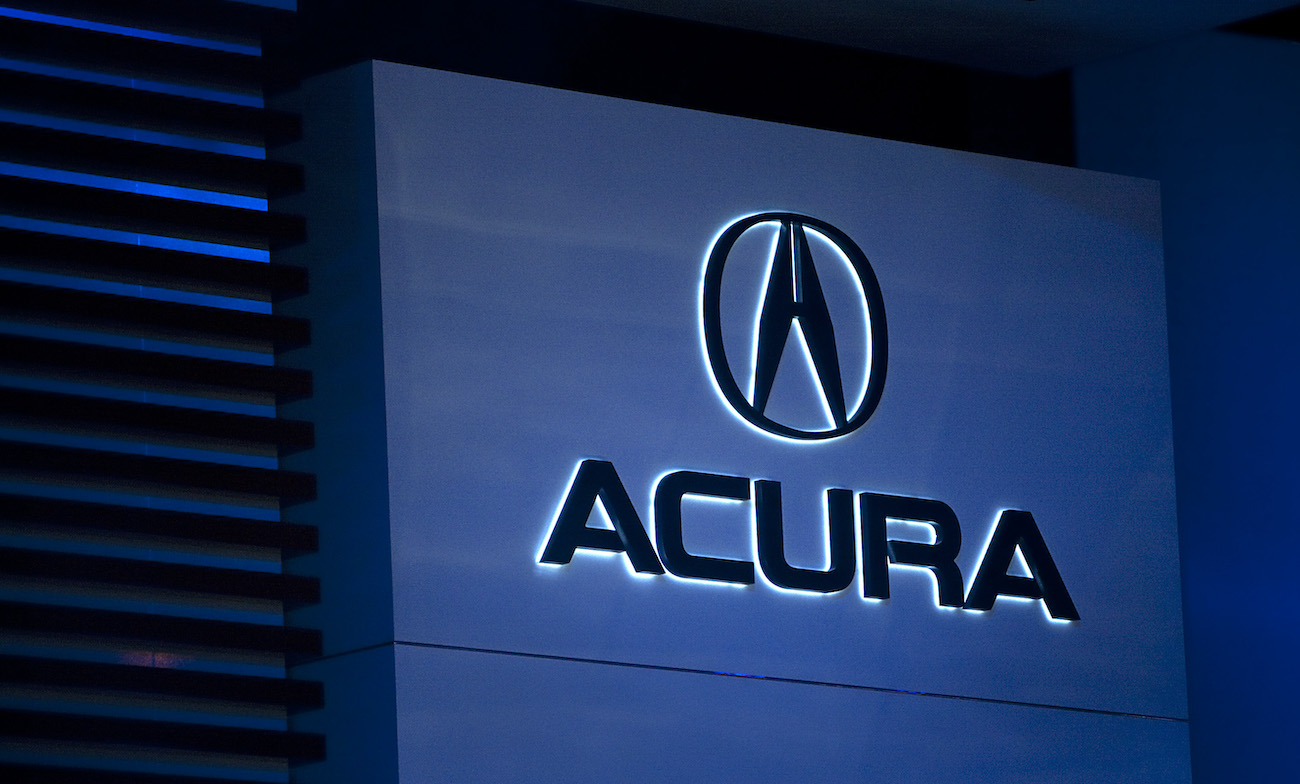 The Acura logo at the NAIAS. The 2010 Acura MDX is one of the best used SUVs to buy under $10,000