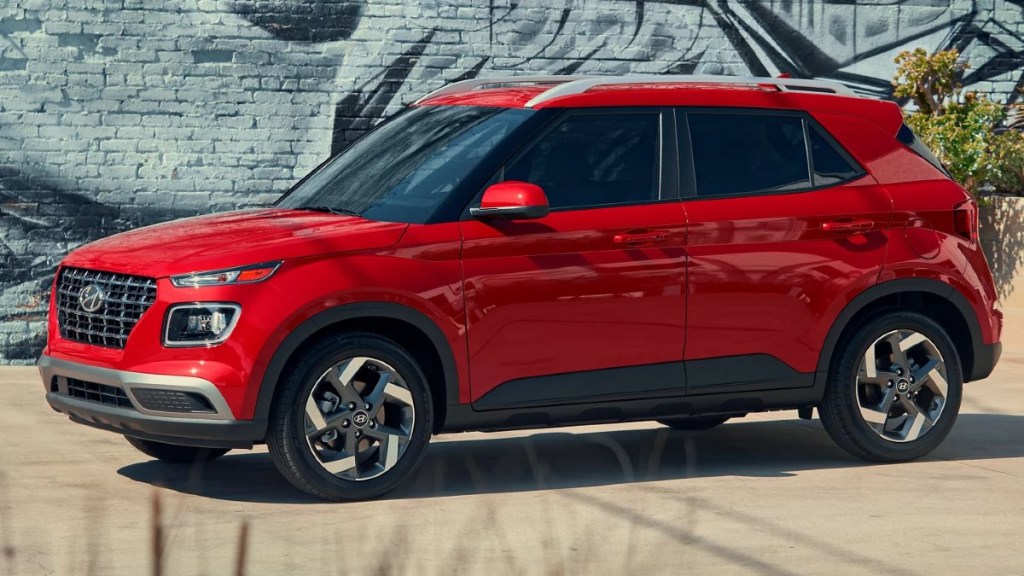 Affordable 2023 Hyundai Venue, one of only two new SUVs that costs $19K, parked near a wall
