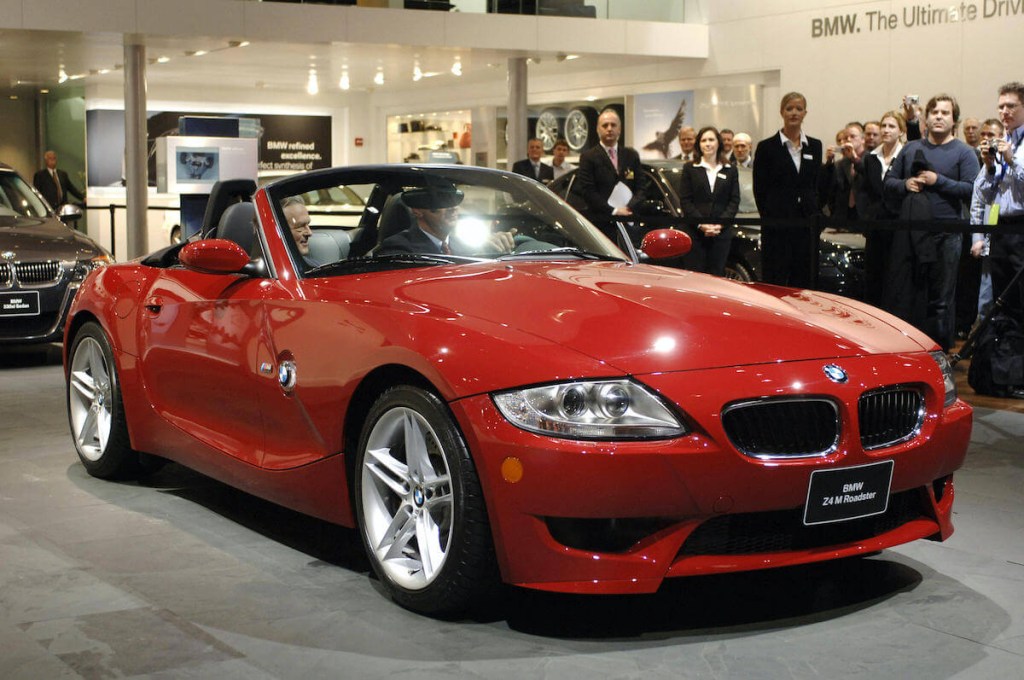 A red BMW Z4 convertible at an auto show