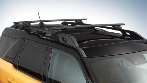 Crossbar accessories installed on the roof of a new Ford Bronco Sport.