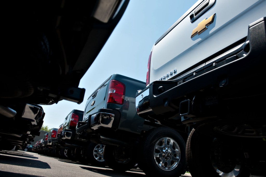 Views From An Auto Dealership showing the tail gates of multiple Chevy pickup trucks.