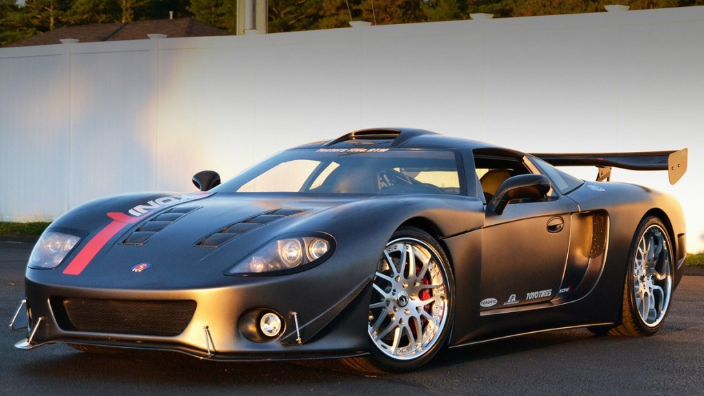 Factory Five GTM Finished and Posed Near a Fence - This is one of the cheapest supercars, but you have to build it yourself