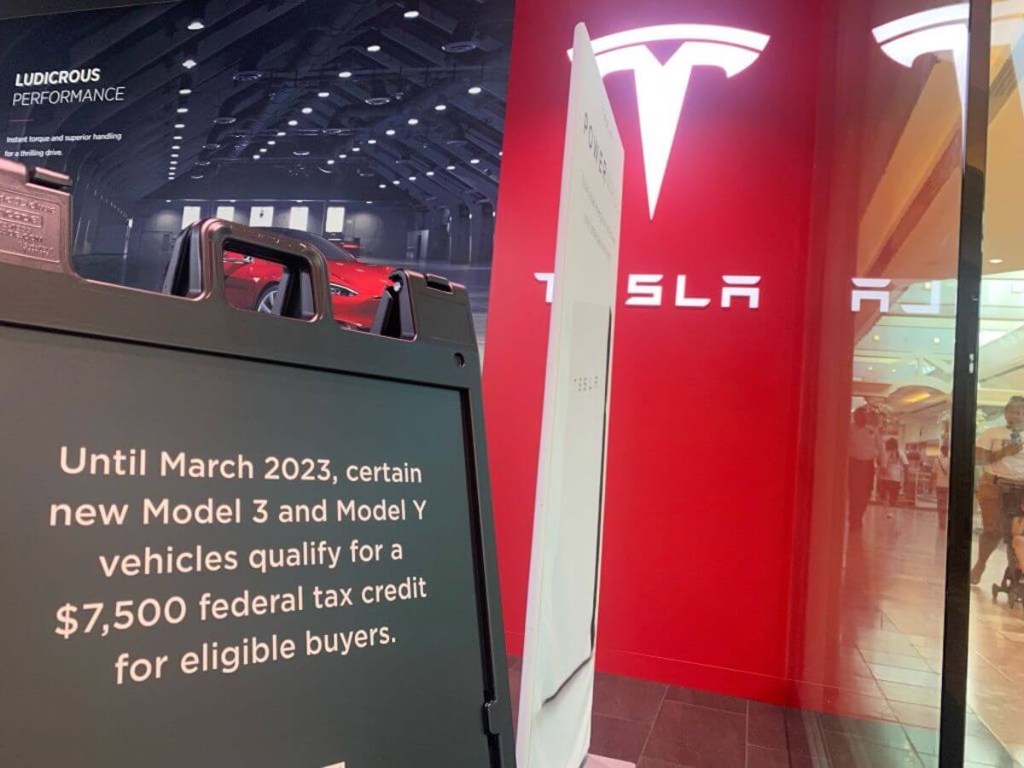 Federal tax credit notice at EV charging station