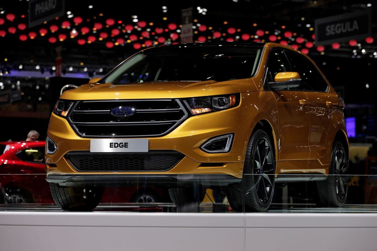 A yellow/gold Ford Edge midsize SUV model presented at the 2015 Geneva Motor Show in Switzerland