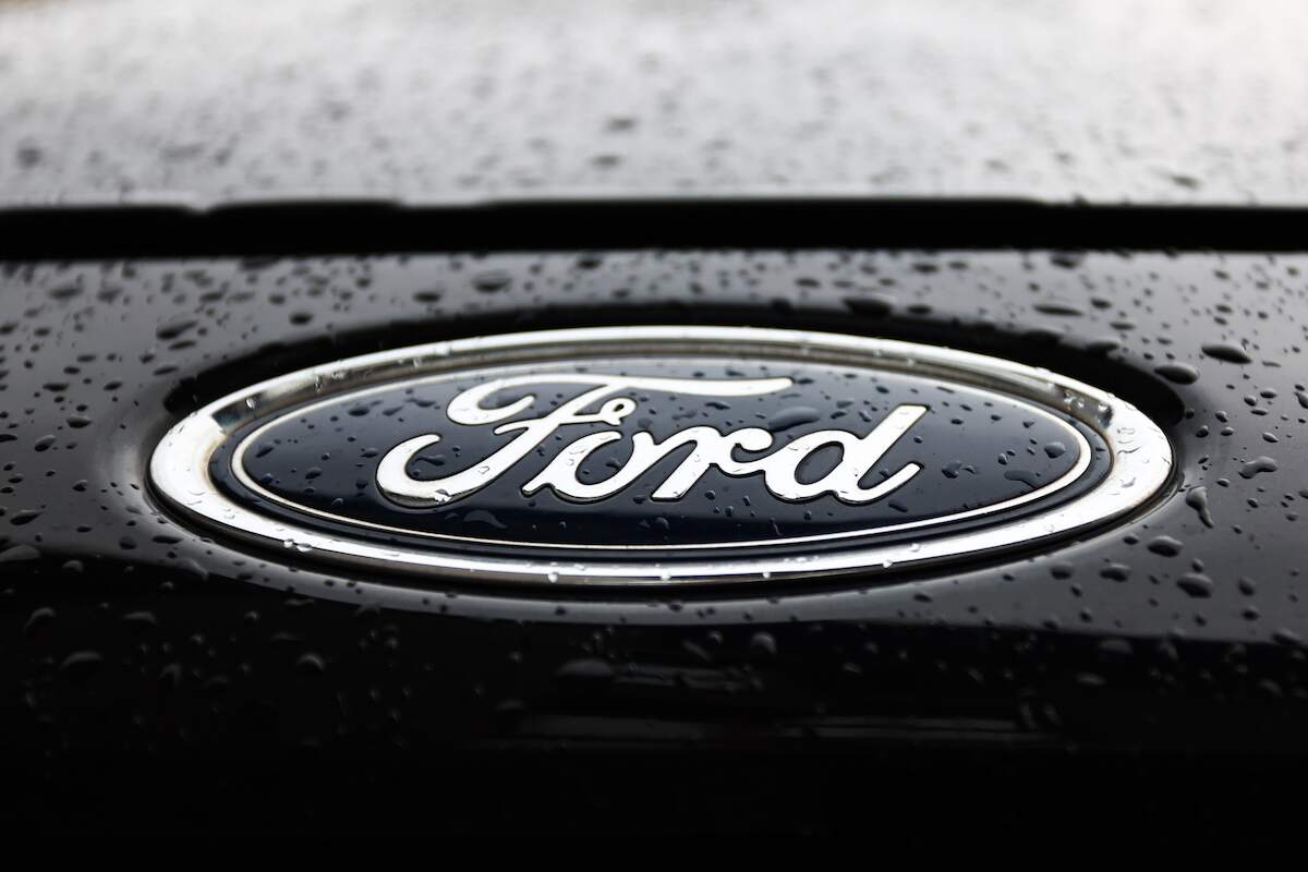 A blue Ford logo on a black vehicle.