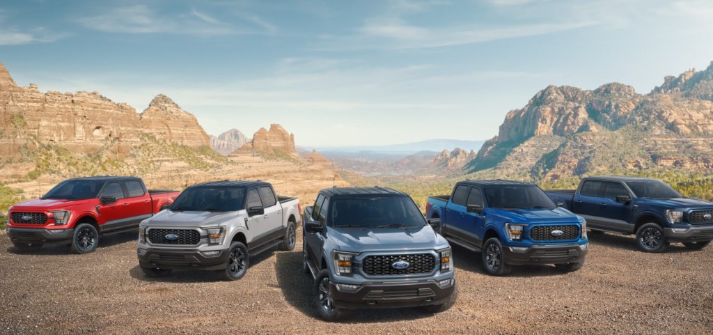 A lineup of 2023 Ford F-Series trucks sits in the desert.