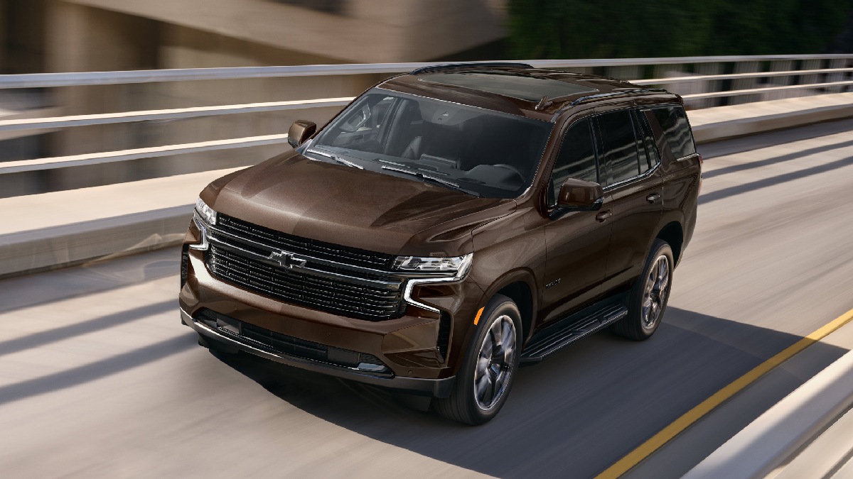 Front angle view of brown 2023 Chevy Tahoe, most reliable large SUV, says J.D. Power, not 2023 Toyota Sequoia