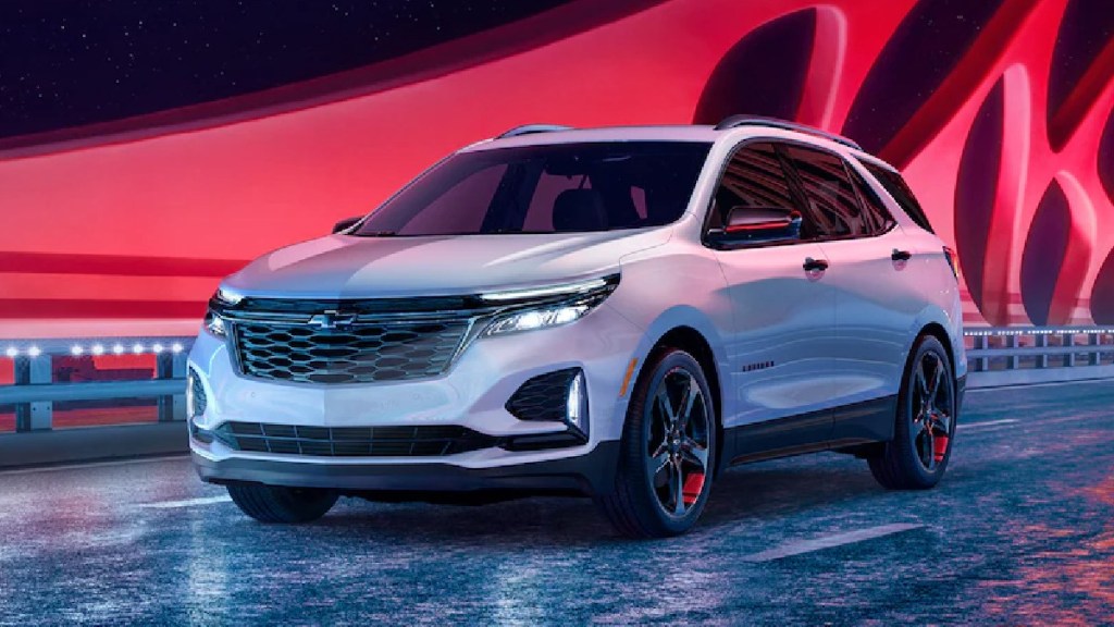 Front angle view of white 2023 Chevy Equinox compact crossover SUV