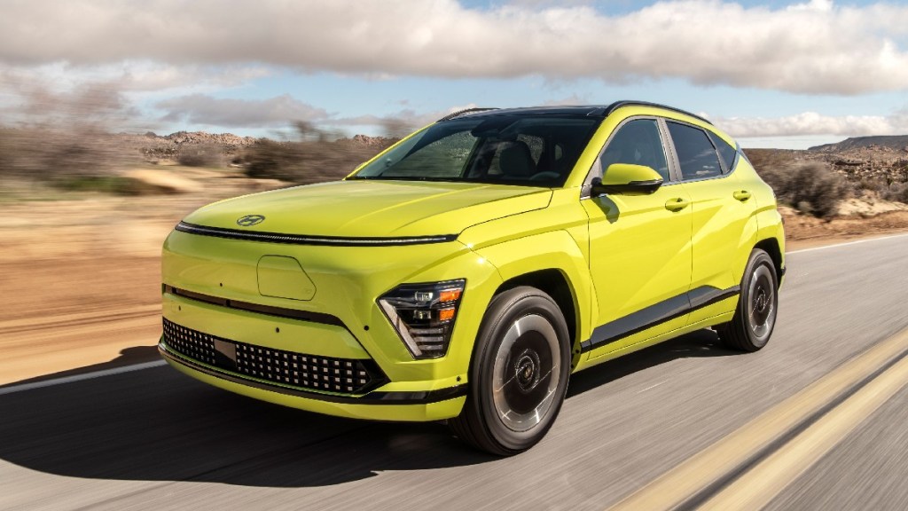 Front angle view of yellow 2024 Hyundai Kona Electric subcompact crossover SUV