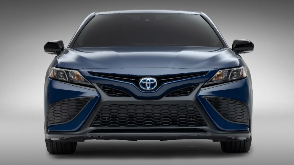 Front view of blue 2023 Toyota Camry Hybrid midsize sedan