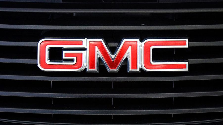 A GMC logo seen on the front of an SUV.