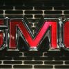 The GMC emblem on a vehicle grille as seen on the GMC Typhoon performance SUV model