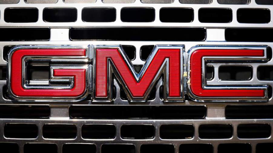 A close up of the GMC logo on the grille.