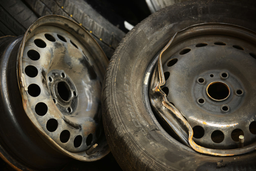 two car rims damaged by potholes
