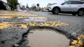 A large pothole filled with mud in San Francisco
